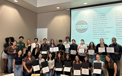 Group of SDSU students holding their certificates for completing CRLA program.